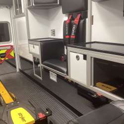 Photo of Roscoe Fire Department ambulance vehicle showing the interior with available equipment and hardware.