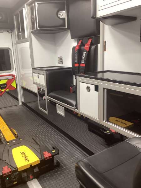 Photo of Roscoe Fire Department ambulance vehicle showing the interior with available equipment and hardware.