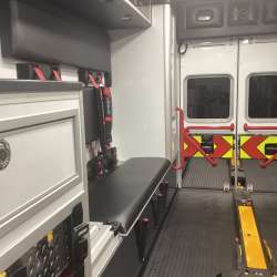 Photo of Roscoe Fire Department ambulance vehicle showing the interior with available equipment and hardware.