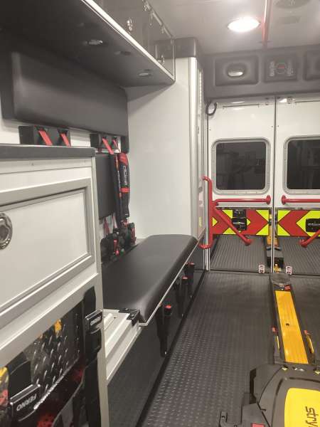 Photo of Roscoe Fire Department ambulance vehicle showing the interior with available equipment and hardware.