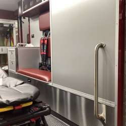 Photo of Interior view of the ambulance patient care area.