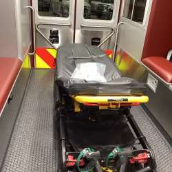 Photo of Interior view of the ambulance patient care area.