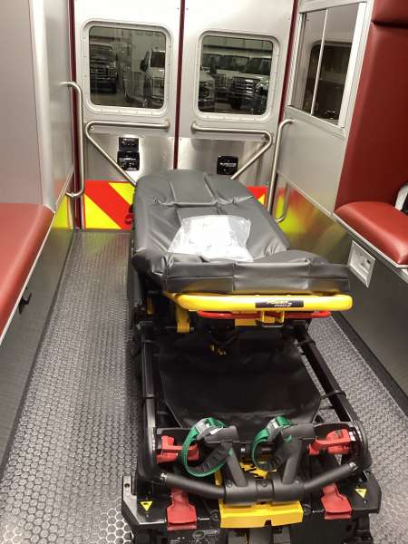 Photo of Interior view of the ambulance patient care area.