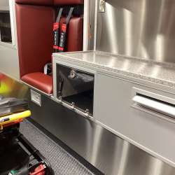 Photo of Interior view of the ambulance patient care area.