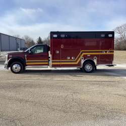 Photo of Troy Fire Department ambulance parked outdoors showcasing the vehicle.