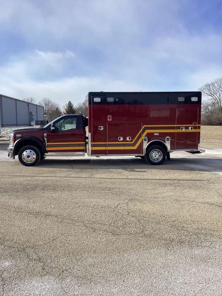 Photo of Troy Fire Department ambulance parked outdoors showcasing the vehicle.
