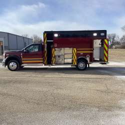 Photo of Troy Fire Department ambulance parked outdoors showcasing the vehicle.