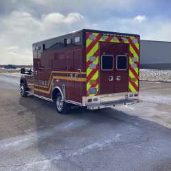 Photo of Troy Fire Department ambulance parked outdoors showcasing the vehicle.
