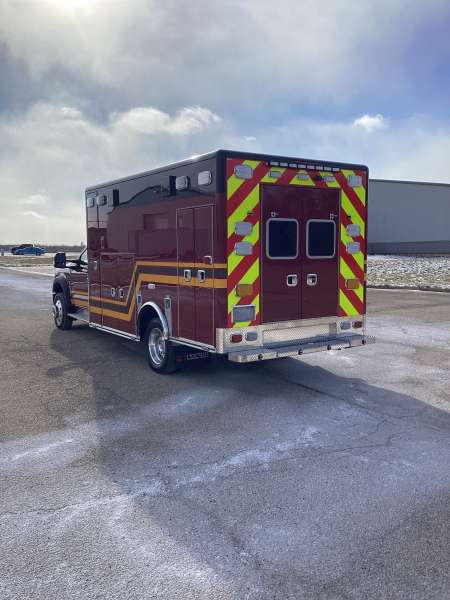 Photo of Troy Fire Department ambulance parked outdoors showcasing the vehicle.