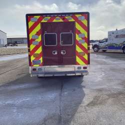 Photo of Troy Fire Department ambulance parked outdoors showcasing the vehicle.