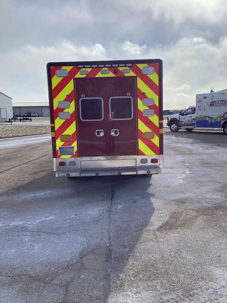 Photo of Troy Fire Department ambulance parked outdoors showcasing the vehicle.