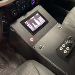 Photo of Interior view of an ambulance driver’s cab showing the center control console.