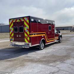 Photo of Troy Fire Department ambulance parked outdoors showcasing the vehicle.
