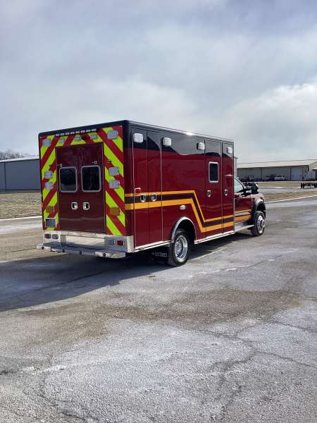 Photo of Troy Fire Department ambulance parked outdoors showcasing the vehicle.