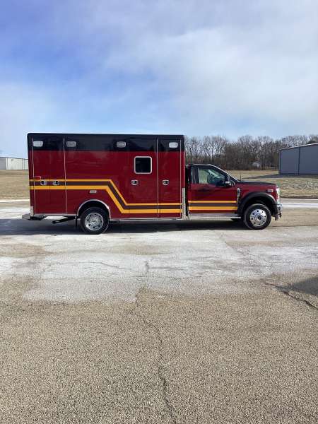 Photo of Troy Fire Department ambulance parked outdoors showcasing the vehicle.