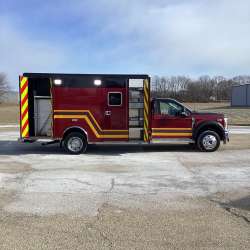 Photo of Troy Fire Department ambulance parked outdoors showcasing the vehicle.