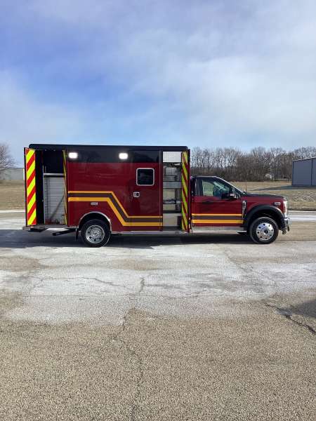 Photo of Troy Fire Department ambulance parked outdoors showcasing the vehicle.