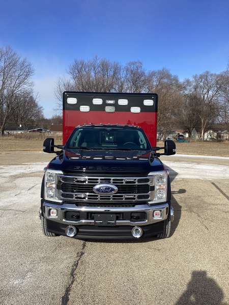 Photo of Troy Fire Department ambulance parked outdoors showcasing the vehicle.