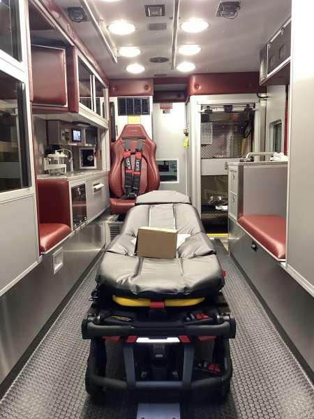 Photo of Interior view of the ambulance patient care area.