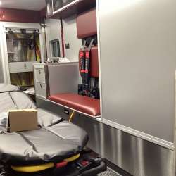 Photo of Interior view of the ambulance patient care area.