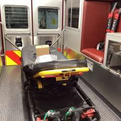 Photo of Interior view of the ambulance patient care area.