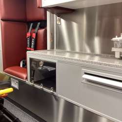Photo of Interior view of the ambulance patient care area.
