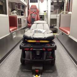 Photo of Interior view of the ambulance patient care area.